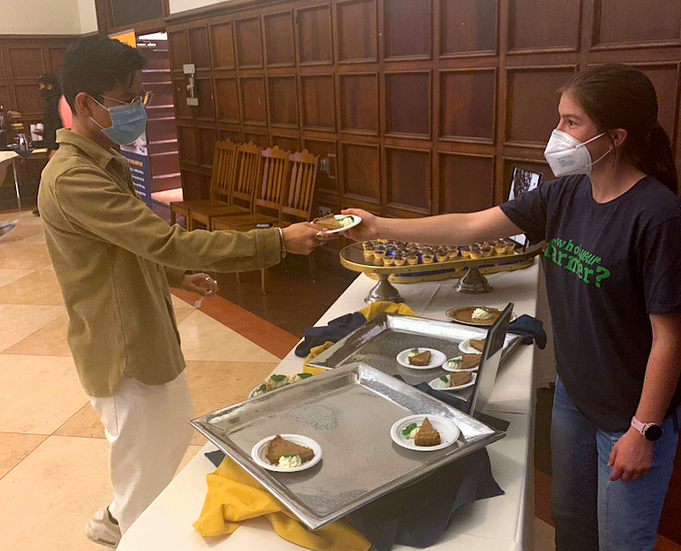 Juliette Nast handing out the finished yellow-eyed bean pies