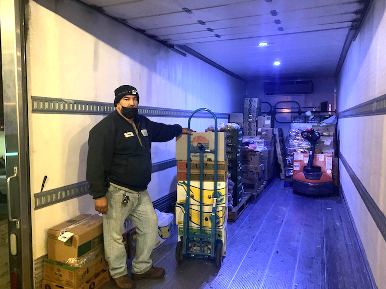 Manny ready to unload produce for the recipe challenge at Clark Kerr