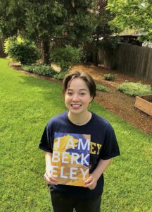 Nina posing with her “I am Berkeley” acceptance folder after committing to Cal. 