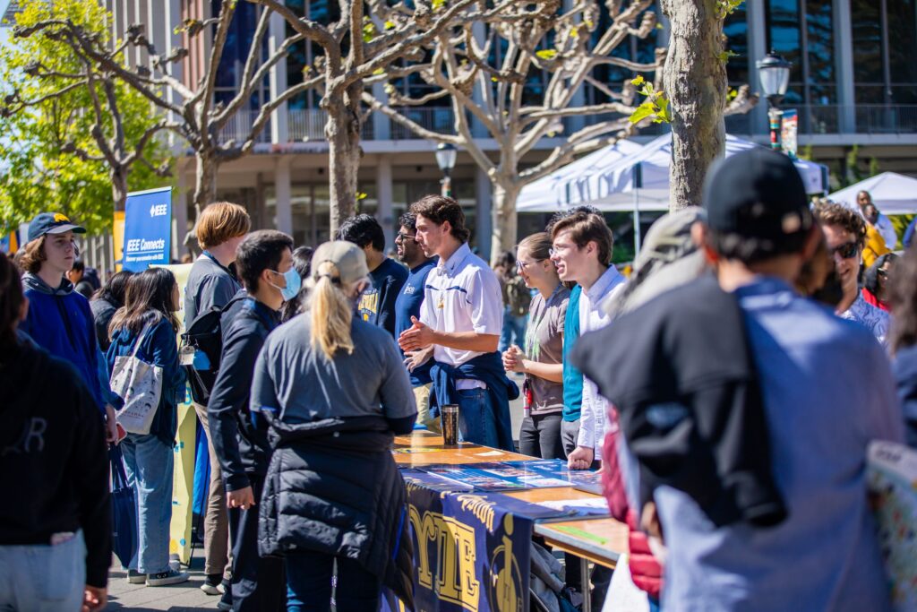 People talking with the clubs tabling on Upper Sproul.