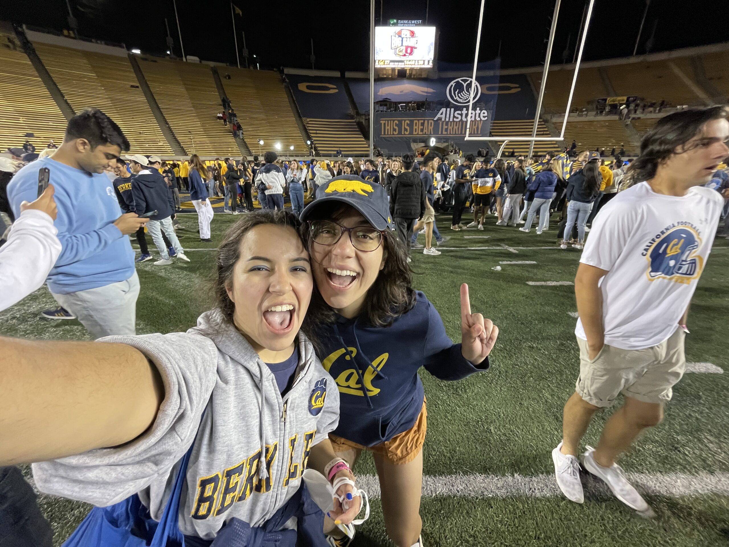 Recent graduates rocking school spirit at a Cal football game.