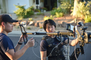 Steven Zeng (right) filming on set.