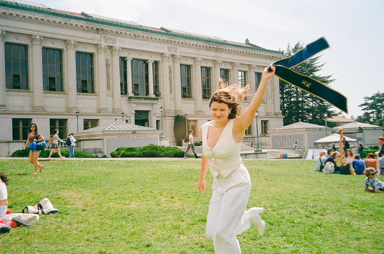 Preslee running through the Memorial Glade waving her stole.